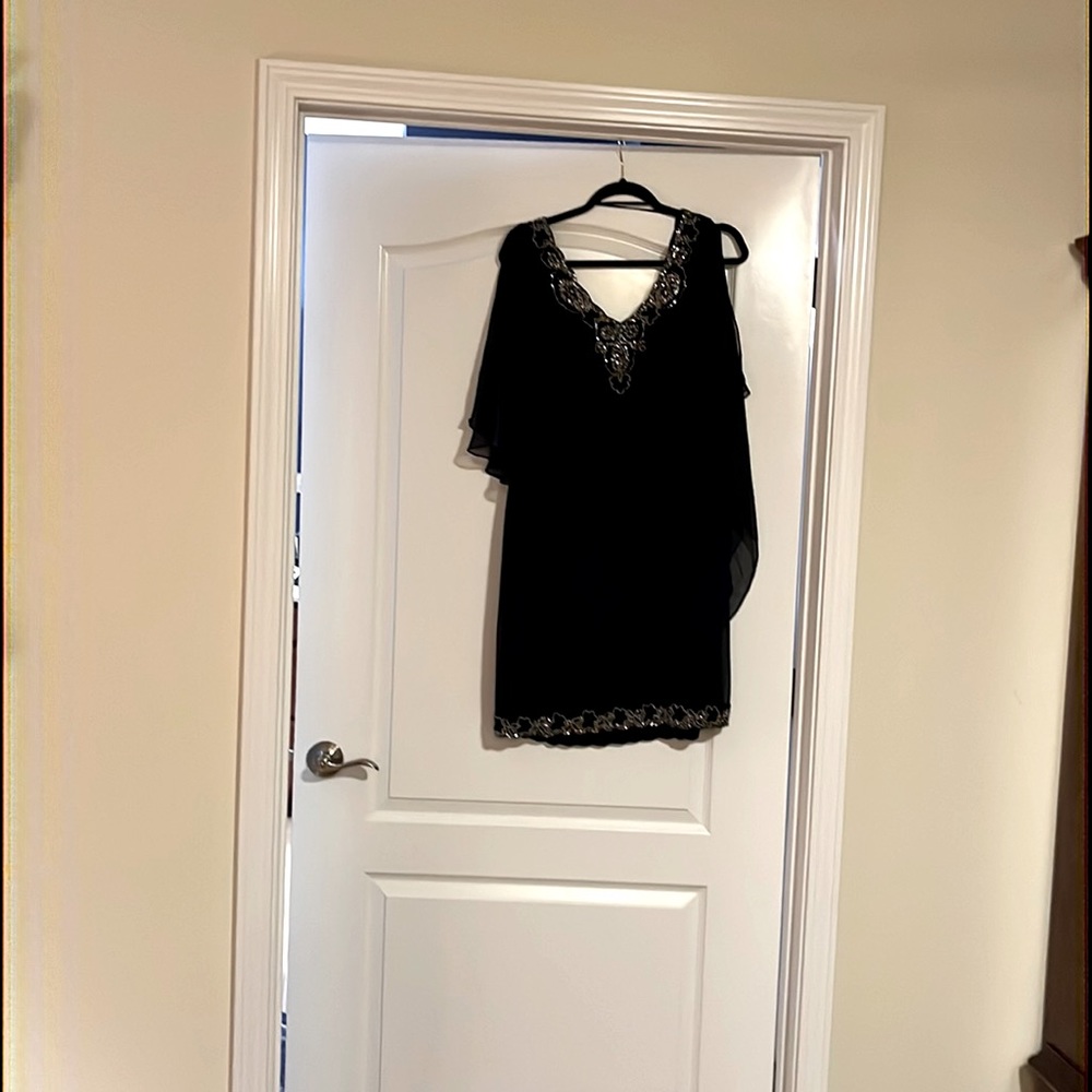 Navy blue sheath dress with sheet overlay and embellishments